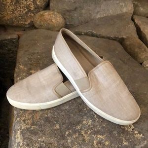 Slightly worn slip on sneakers